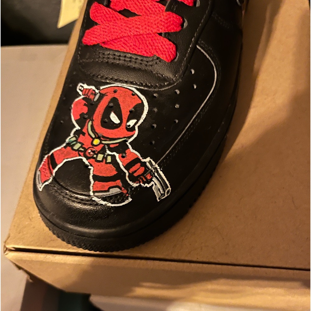 Nike Air Force ones black size 9.5 drawn on wolverines and Deadpool